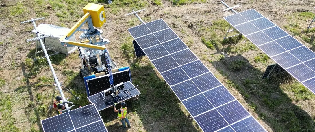 CrewMate lifting solar panels on a job site