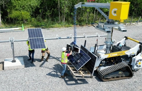 Workers using CrewMate to move solar panels